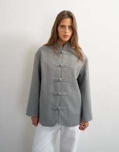 Model wearing Self frogging formal blazer coat in grey
