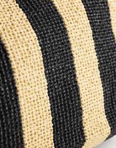 Model wearing Selia stripe straw tote bag in black & natural