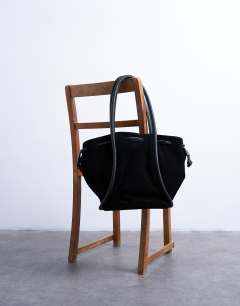 Model wearing Sena real suede leather shoulder bag in black
