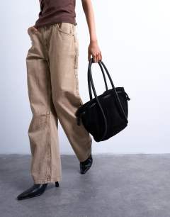 Model wearing Sena real suede leather shoulder bag in black