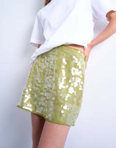 Model wearing Sequin a line mini skirt in green