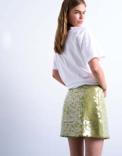Model wearing Sequin a line mini skirt in green