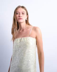 Model wearing Sequin bandeau midi in buttermilk