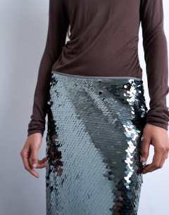 Model wearing Sequin column midi skirt in green