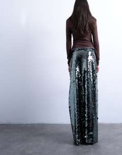 Model wearing Sequin column midi skirt in green
