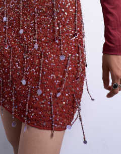 Model wearing Sequin mini skirt in burgundy