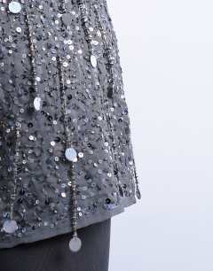 Model wearing Sequin mini skirt in grey
