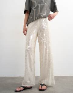Model wearing Sequin tailored trouser in white