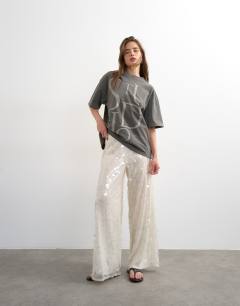 Model wearing Sequin tailored trouser in white