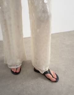 Model wearing Sequin tailored trouser in white