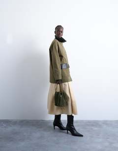 Model wearing Shacket with patch pocket in dark green