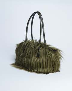 Model wearing Shaggy faux fur shoulder bag in khaki