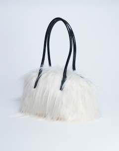 Model wearing Shaggy faux fur shoulder bag in off white