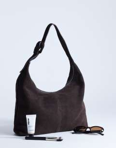 Model wearing Shayla real suede shoulder bag in chocolate