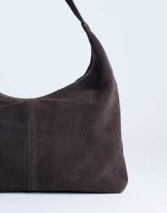 Model wearing Shayla real suede shoulder bag in chocolate