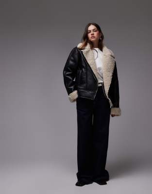 shearling aviator jacket in black and cream