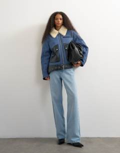 Model wearing Shearling belted biker jacket in blue