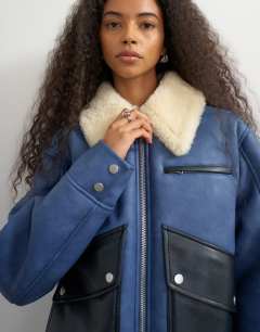 Model wearing Shearling belted biker jacket in blue