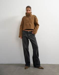 Model wearing Shearling double breasted short biker in tan