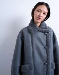 Model wearing Shearling oversized car coat in grey