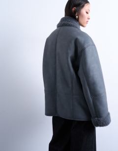 Model wearing Shearling oversized car coat in grey