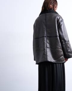 Model wearing Shearling oversized patch pocket mid length funnel neck car coat in black