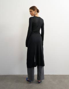 Model wearing Sheer button down long line top in black