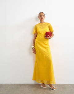Model wearing Sheer chiffon maxi dress with pintuck details in Marigold