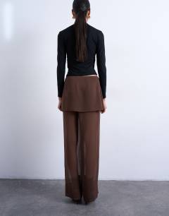 Model wearing Sheer double layer mock skirt trouser in brown