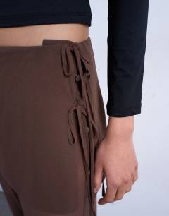 Model wearing Sheer double layer mock skirt trouser in brown
