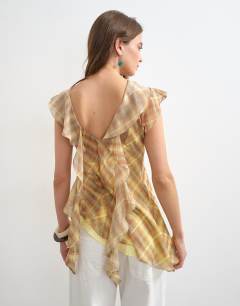 Model wearing Sheer drape neck top in warped pastel check