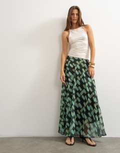 Model wearing Sheer full circle chiffon maxi skirt in blue geometric print