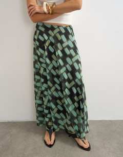Model wearing Sheer full circle chiffon maxi skirt in blue geometric print