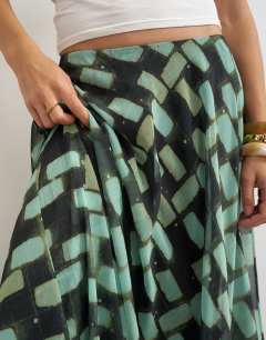 Model wearing Sheer full circle chiffon maxi skirt in blue geometric print