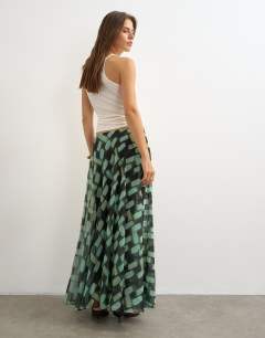 Model wearing Sheer full circle chiffon maxi skirt in blue geometric print