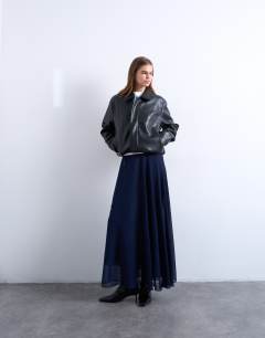 Model wearing Sheer full circle chiffon maxi skirt in navy