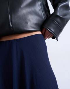 Model wearing Sheer full circle chiffon maxi skirt in navy