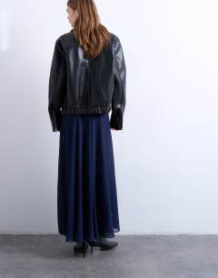 Model wearing Sheer full circle chiffon maxi skirt in navy