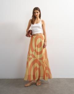Model wearing Sheer full circle chiffon midi skirt in orange abstract print