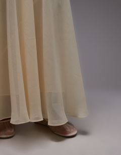 Model wearing Sheer full circle chiffon skirt in buttermilk