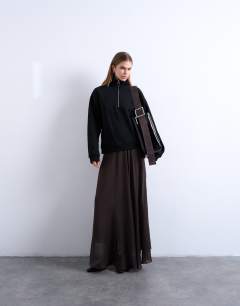 Model wearing Sheer full circle maxi skirt in chocolate
