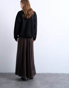 Model wearing Sheer full circle maxi skirt in chocolate
