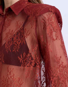 Model wearing Sheer lace shirt in rust