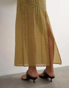 Model wearing Sheer maxi skirt in khaki