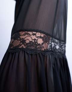 Model wearing Sheer maxi with lace inserts in black