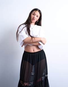 Model wearing Sheer maxi with lace inserts in black