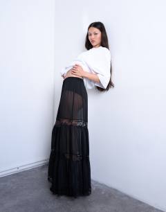 Model wearing Sheer maxi with lace inserts in black
