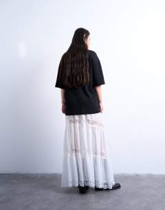 Model wearing Sheer maxi with lace inserts in ivory