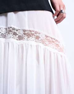 Model wearing Sheer maxi with lace inserts in ivory