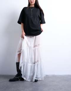 Model wearing Sheer maxi with lace inserts in ivory